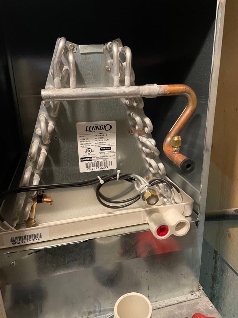Lennox evaporator coil indoor HVAC component with aluminum fins, copper R-410A refrigerant tubing, and specification label